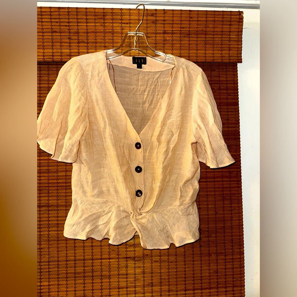 Linen cream colored blouse with peplum … so cute with jeans!